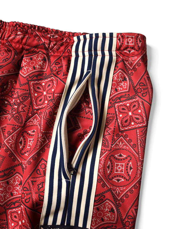 Kapital smooth jersey baggy track pants in cookie bandana print